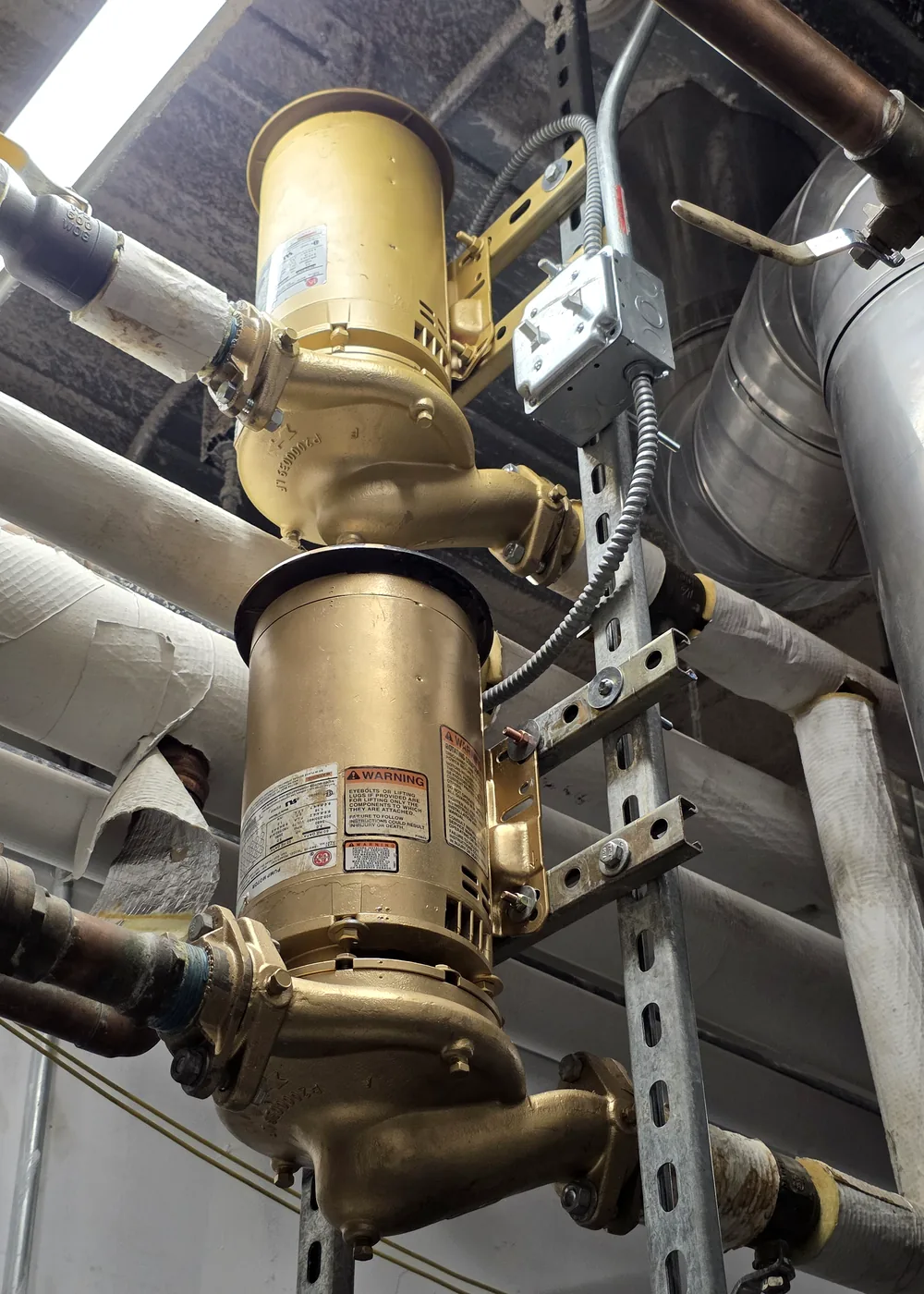 Gold mechanical pumps coordinated with insulated piping and ductwork